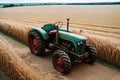 An old tractor resting in a sun kissed field of wheat