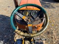 An old tractor steering wheel closeup Royalty Free Stock Photo