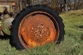 Old tractor tire and wheel full of rust