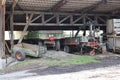 Old tractor and trailer on a farm in the countryside. Industrial background Royalty Free Stock Photo