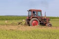 Old tractor working on the field Royalty Free Stock Photo