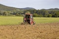 Old tractor working on the field Royalty Free Stock Photo