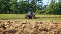 Old tractor working on the field Royalty Free Stock Photo