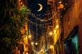 Old traditional arabic street in night with ramadan garlands and crescent moon