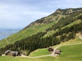 Old traditional architecture and farmhouse on the slopes of Vitznauerstock peak