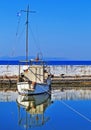 Boat reflection on a small pond at Palaio Faliro Attica Greece