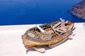 Old traditional boat on terrace, Santorini island Royalty Free Stock Photo