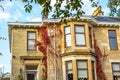 Old, traditional British house with red ivy Royalty Free Stock Photo