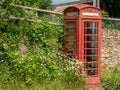 Old traditional British telephone box in Naunton, The Cotswolds, UK Royalty Free Stock Photo