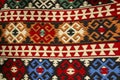 Old traditional carpet with a geometric pattern blue, white and dark red colors in arabic style on bazaar in Mostar, Bosnia and Royalty Free Stock Photo