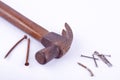 old Traditional curved claw hammer and rust nail tack used on white background tool isolated