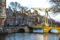 Old traditional Dutch bridge in the city channel close-up