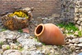 Old traditional georgian wine region symbol background with wheel and qvevri jug