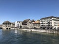 Old traditional houses and residential buildings along the river Limmat in the city of Zurich Royalty Free Stock Photo