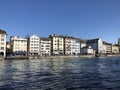 Old traditional houses and residential buildings along the river Limmat in the city of Zurich Royalty Free Stock Photo