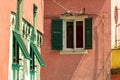 Old traditional Italian house with wooden windows green shutters Royalty Free Stock Photo