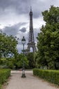 Old traditional lamp post pillar with Eiffel Tower in background in Paris