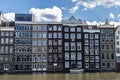 Old traditional leaning houses along the canal in Amsterdam, Netherlands Royalty Free Stock Photo