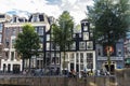 Old traditional leaning houses along the canal in Amsterdam, Netherlands