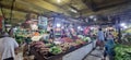 An old traditional market full of visitors in the vegetable and fruit area.