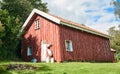 Old traditional Norwegian red barn, around the birch forest Royalty Free Stock Photo