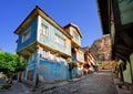 Old traditional ottoman house street with the Karahisar castle i Royalty Free Stock Photo