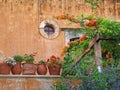 Old monastery wall and pots in Crete Royalty Free Stock Photo