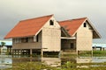 The old traditional red roof houses nearly the lagoon in south east asia culture Royalty Free Stock Photo