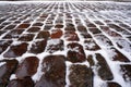 Stone pavement covered with snow in winter Royalty Free Stock Photo