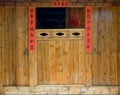 The old traditional style wood carving door with Spring festival couplets during Chinese new year