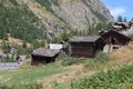 Old and traditional Swiss Alps chalets co-exist with modern houses Royalty Free Stock Photo