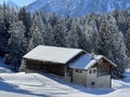 Old traditional swiss rural architecture and alpine livestock farms in the winter ambience of the resorts Valbella and Lenzerheid