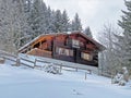 Old traditional swiss rural architecture and alpine livestock farms in the winter ambience of the tourist resort of Lenzerheide