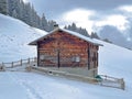 Old traditional swiss rural architecture and alpine livestock farms in the winter ambience of the tourist resort of Lenzerheide