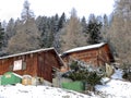 Old traditional swiss rural architecture and alpine livestock farms in the winter ambience of the tourist resort of Lenzerheide