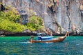 Old traditional Thai motorboat made of wood for fishing and tourists on excursions in the Andaman Sea near Phi Phi Leh island in Royalty Free Stock Photo