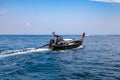 Old traditional Thai motorboat made of wood for fishing and tourists on excursions in the Andaman Sea near Phi Phi Leh island in Royalty Free Stock Photo