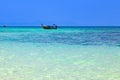 Old traditional Thai motorboat made of wood for fishing and transporting tourists on excursions in the Andaman Sea in clear Royalty Free Stock Photo