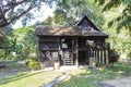 Old traditional Thai style house in the park, summer outdoor day light Royalty Free Stock Photo