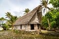 Old traditional thatched yapese men`s meeting house faluw or fale. Yap island, Federated States of Micronesia, Oceania. Royalty Free Stock Photo