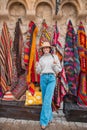 Old traditional Turkish carpet shop in cave house Cappadocia, Turkey Kapadokya. Young woman on vacation in Turkey Royalty Free Stock Photo