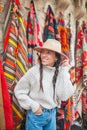 Old traditional Turkish carpet shop in cave house Cappadocia, Turkey Kapadokya. Young woman on vacation in Turkey Royalty Free Stock Photo