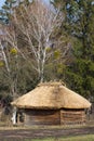 Old traditional Ukrainen barn or shack under blue sky