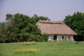 Old traditional ukrainian rural cottage with a straw roof Royalty Free Stock Photo