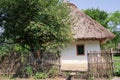 Old traditional ukrainian rural cottage with a straw roof Royalty Free Stock Photo