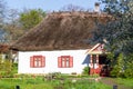 Ancient traditional ukrainian rural cottage with a straw roof Royalty Free Stock Photo