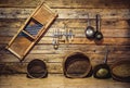 Old traditional utensils hanging on wooden wall at kitchen Royalty Free Stock Photo