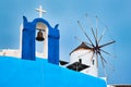 Old greek windmill on Santorini island in Oia town with stairs in street. Santorini, Greece Royalty Free Stock Photo