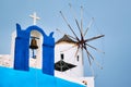 Old greek windmill on Santorini island in Oia town with stairs in street. Santorini, Greece Royalty Free Stock Photo