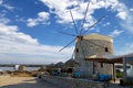 Old traditional windmill on Agios Ioannis beach Royalty Free Stock Photo